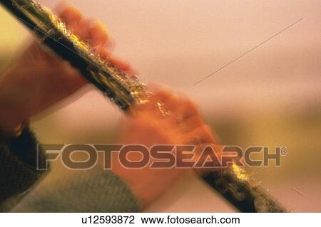 Stock Image - Person play a clarinet. Fotosearch
