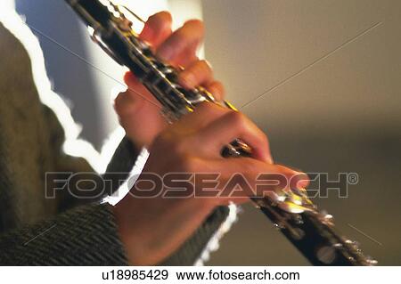Person play a clarinet View Large Photo Image Stock Photo - Person play a clarinet. Fotosearch