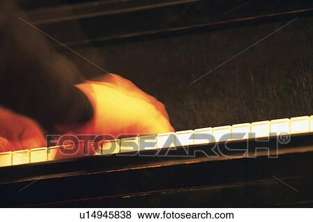 Stock Photo - Person play a piano. Fotosearch
