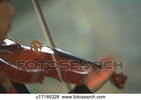 Stock Photo - Person play a violin. Fotosearch