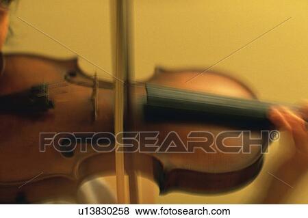 Stock Photo - Person play Violin. Fotosearch