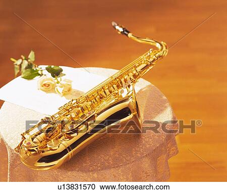 Saxophone on the table View Large Photo Image Stock Image - Saxophone on the table. Fotosearch