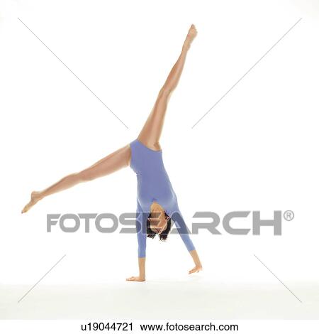 A woman in Leotard doing handstand, Front View, Copy Space View Large Photo Image Stock Image - A woman in Leotard doing handstand, Front View, Copy Space. Fotosearch