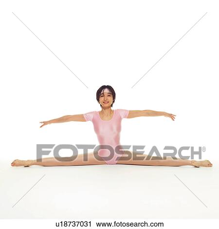 Stock Image - A woman in Leotard exercising, Front View, Copy Space. Fotosearch