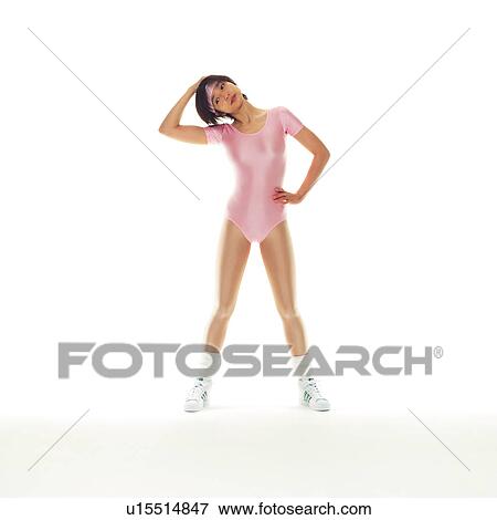 Stock Photo - A woman in Leotard exercising, Front View, Copy Space. Fotosearch