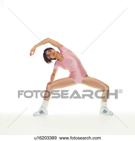 Stock Photo - A woman in Leotard exercising, Front View, Copy Space. Fotosearch