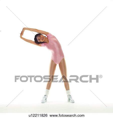 Stock Photograph - A woman in Leotard exercising, Front View, Copy Space. Fotosearch