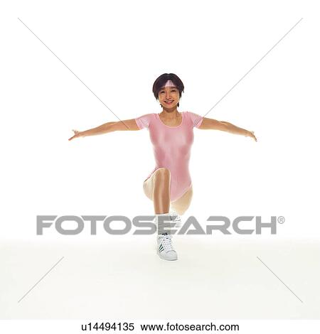 Stock Photography - A woman in Leotard exercising, Front View, Copy Space. Fotosearch