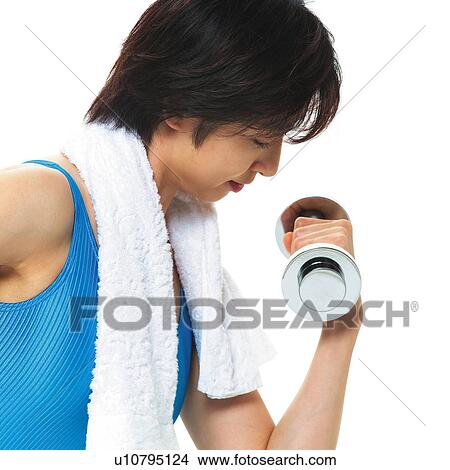 A woman in Leotard exercising with a dumbbell, Side View View Large Photo Image Picture - A woman in Leotard exercising with a dumbbell, Side View. Fotosearch