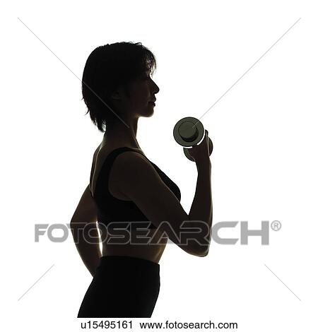 A woman in Leotard exercising with a dumbbell, Side View, Silhouette, Copy Space View Large Photo Image Stock Image - A woman in Leotard exercising with a dumbbell, Side View, Silhouette, Copy Space. Fotosearch