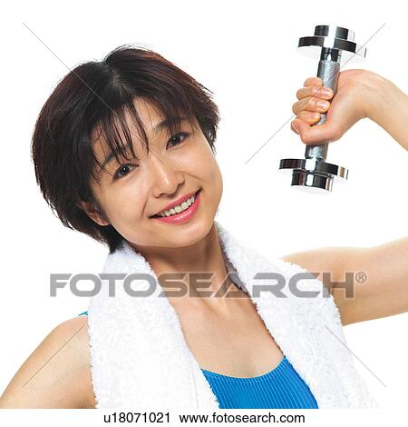Stock Image - A woman in Leotard exercising with a dumbbell, Front View. Fotosearch