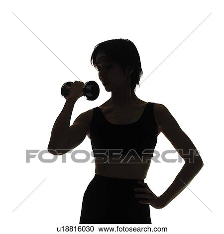 Stock Image - A woman in Leotard exercising with a dumbbell, Front View, Silhouette. Fotosearch
