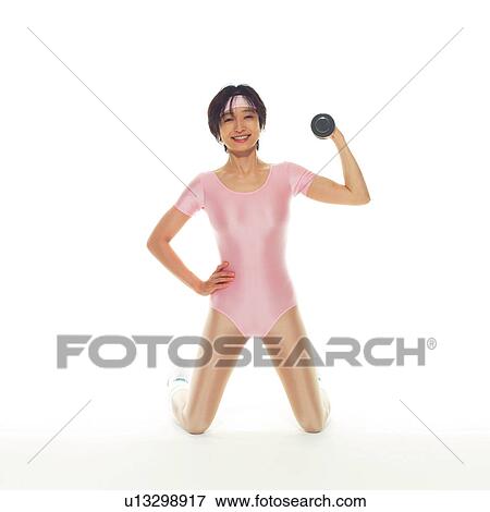 A woman in Leotard exercising with a dumbbell, Front View View Large Photo Image Stock Photo - A woman in Leotard exercising with a dumbbell, Front View. Fotosearch
