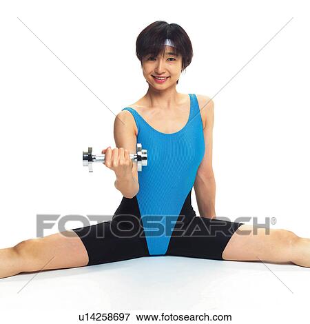 Stock Photo - A woman in Leotard exercising with a dumbbell, Front View. Fotosearch