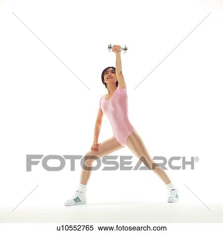 Stock Photography - A woman in Leotard exercising with a dumbbell, Front View, Copy Space. Fotosearch