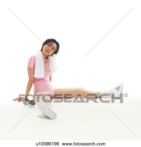 Stock Photograph - A woman in Leotard having a break, Side View, Copy Space. Fotosearch