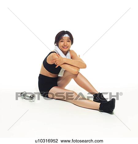 Stock Image - A woman in Leotard resting, High Angle View, Copy Space. Fotosearch