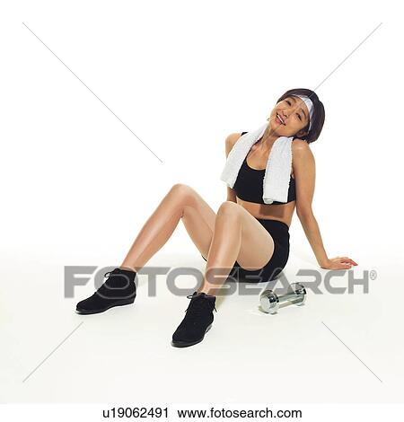 Stock Image - A woman in Leotard resting, High Angle View, Copy Space. Fotosearch