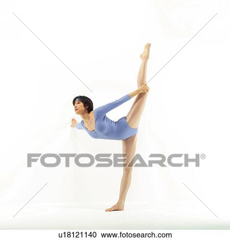 Stock Image - A woman in Leotard standing on foot, Side View, Copy Space. Fotosearch