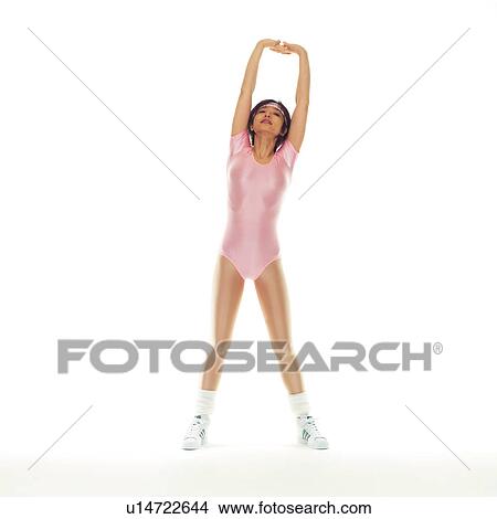 Picture - A woman in Leotard stretching, Front View, Copy Space. Fotosearch