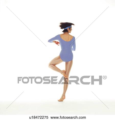 Stock Photography - A woman in Leotard turning, Rear View, Copy Space. Fotosearch