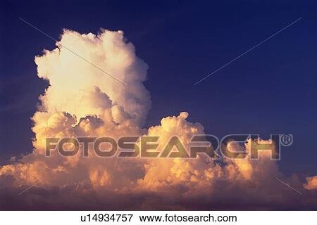 a Huge Cloud, Partly Red From the Setting Sun, Low Angle View, Bahamas, North America View Large Photo Image Stock Photo - a Huge Cloud, Partly Red From the Setting Sun, Low Angle View, Bahamas, North America. Fotosearch
