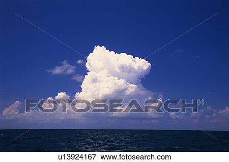 a Huge White Cloud Over the Deep Blue Ocean, Bahamas, North America View Large Photo Image Stock Photo - a Huge White Cloud Over the Deep Blue Ocean, Bahamas, North America. Fotosearch