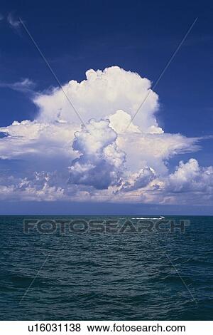 a Huge White Cloud Spreading Over the Ocean, Front View View Large Photo Image Stock Photo - a Huge White Cloud Spreading Over the Ocean, Front View. Fotosearch