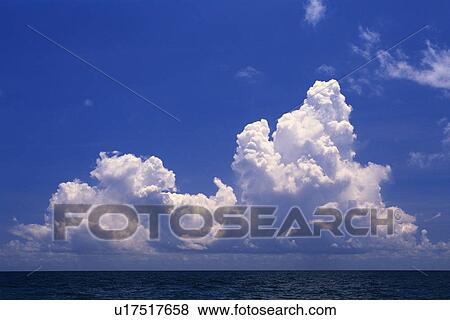 a Huge White Clouds Over the Deep Blue Ocean, Bahamas, North America View Large Photo Image Stock Photo - a Huge White Clouds Over the Deep Blue Ocean, Bahamas, North America. Fotosearch