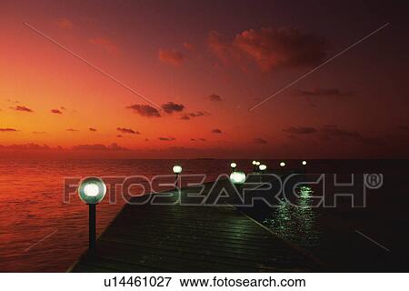 a Wooden Boardwalk Surrounded By the Ocean by Sunset, High Angle View, Maldives, Micronesia View Large Photo Image Stock Photo - a Wooden Boardwalk Surrounded By the Ocean by Sunset, High Angle View, Maldives, Micronesia. Fotosearch