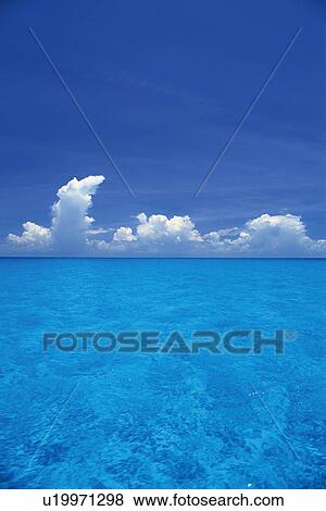 Clear Ocean water Under a Blue Sky, High Angle View, Copy Space, Bahamas, North America View Large Photo Image Stock Photo - Clear Ocean water Under a Blue Sky, High Angle View, Copy Space, Bahamas, North America. Fotosearch