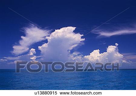 Several Huge White Clouds Spreading Over the Ocean, Front View, Bahamas, North America View Large Photo Image Stock Photography - Several Huge White Clouds Spreading Over the Ocean, Front View, Bahamas, North America. Fotosearch