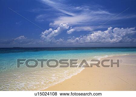 Stock Photo -  the Maldivian Beach With Its Light Blue-colored and Clear Ocean water, Maldives, Micronesia. Fotosearch