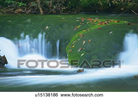 a Huge Rock Covered in Moss, Surrounded By Streaming Water, Front View, Long Exposure, Akita Prefecture, Japan View Large Photo Image Stock Photograph - a Huge Rock Covered in Moss, Surrounded By Streaming Water, Front View, Long Exposure, Akita Prefecture, Japan. Fotosearch