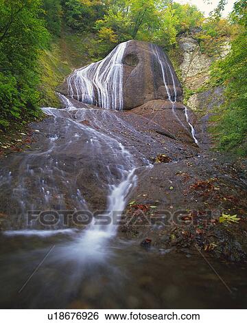 a Waterfall, Surrounded By Little Shrubberies, Low Angle View, Long Exposure View Large Photo Image Stock Photograph - a Waterfall, Surrounded By Little Shrubberies, Low Angle View, Long Exposure. Fotosearch