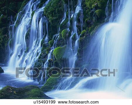 Several Waterfalls, Surrounded By Rocks Covered in Moss, Side View, Long Exposure View Large Photo Image Stock Photo - Several Waterfalls, Surrounded By Rocks Covered in Moss, Side View, Long Exposure. Fotosearch