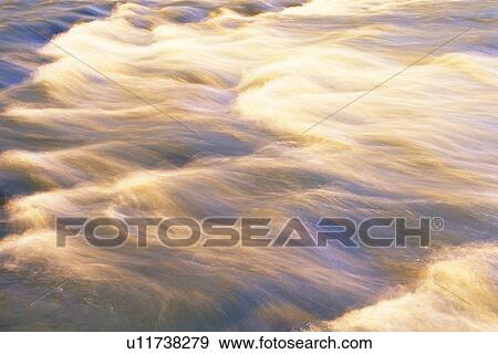 Stock Photo -  Streaming Water, Making Bubbles, High Angle View, Long Exposure. Fotosearch