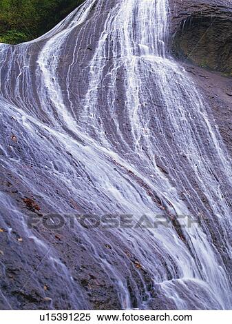 Streaming Waterfall, Spreading Across the Surface, High Angle View View Large Photo Image Stock Photography - Streaming Waterfall, Spreading Across the Surface, High Angle View. Fotosearch