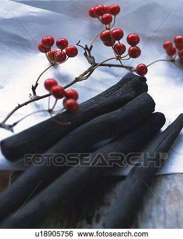 Stock Photograph - Nandin blossoms and charcoals. Fotosearch