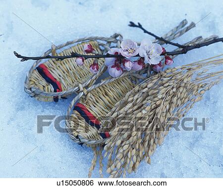 Stock Photograph - Straw sandals and plum blossoms. Fotosearch