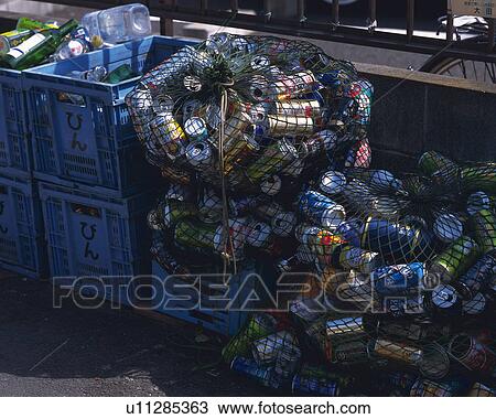 Stock Image - Aluminum cans for recycling in plastic boxes, high angle view. Fotosearch