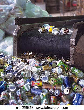 Stock Photo - Aluminum cans on factory conveyer belt, high angle view. Fotosearch