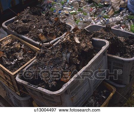 Bottles and drosses for recycling in plastic boxes, high angle view View Large Photo Image Stock Photo - Bottles and drosses for recycling in plastic boxes, high angle view. Fotosearch