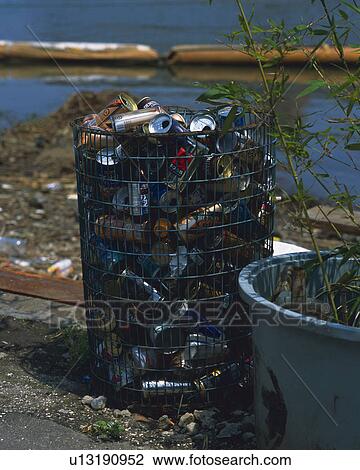 Stock Image - Broken irons in container, high angle view. Fotosearch