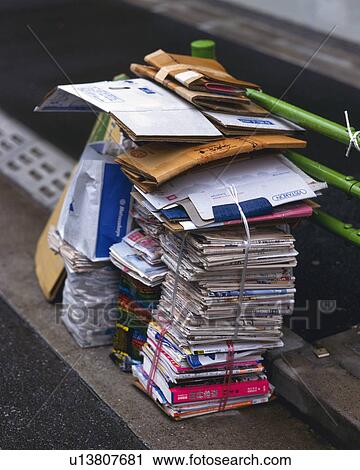 Bundles of magazines and newspapers at rubbish tip, high angle view View Large Photo Image Stock Image - Bundles of magazines and newspapers at rubbish tip, high angle view. Fotosearch