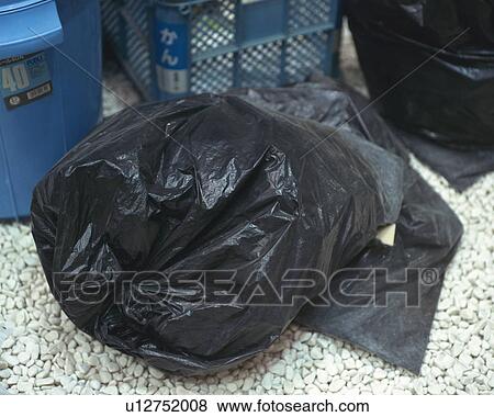 Garbage bags at rubbish tip, high angle view View Large Photo Image Stock Photo - Garbage bags at rubbish tip, high angle view. Fotosearch