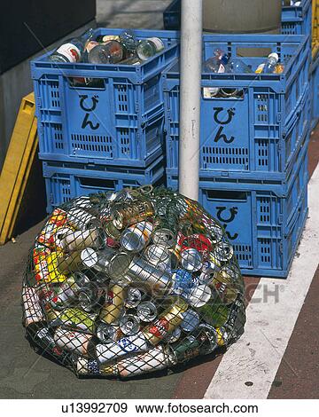 Garbage cans and bottles for recycling at rubbish tip, high angle view View Large Photo Image Stock Photo - Garbage cans and bottles for recycling at rubbish tip, high angle view. Fotosearch