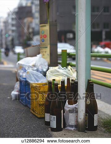 Picture - Garbage for recycling in front of telegraph pole, high angle view, Differential Focus. Fotosearch