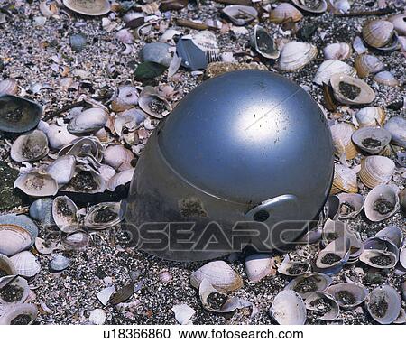 Helmet abandoned on landfill View Large Photo Image Stock Image - Helmet abandoned on landfill. Fotosearch