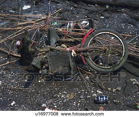 Stock Photo - Rusty Bicycles lying on ground . Fotosearch